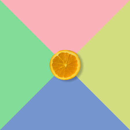 Orange fruit slice on pastel background, Minimal concept.の写真素材