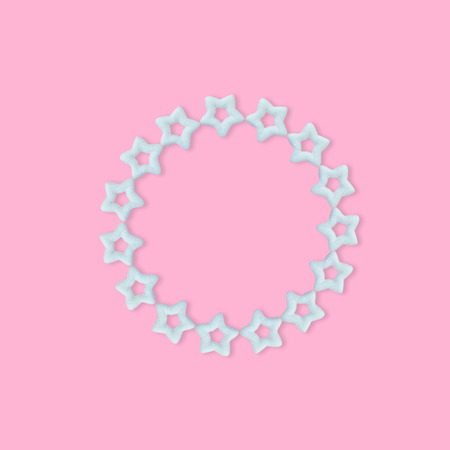 Christmas pastel pink background with glitter star, New Year greeting card, minimal conceptの写真素材