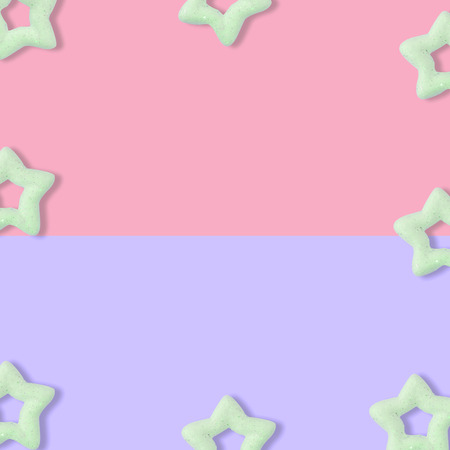Christmas pastel pink and blue background with glitter star, New Year greeting card, minimal conceptの写真素材