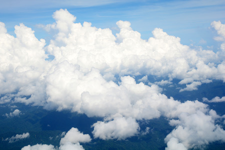 Aerial view Clouds and sky as seen through window of an aircraftの写真素材