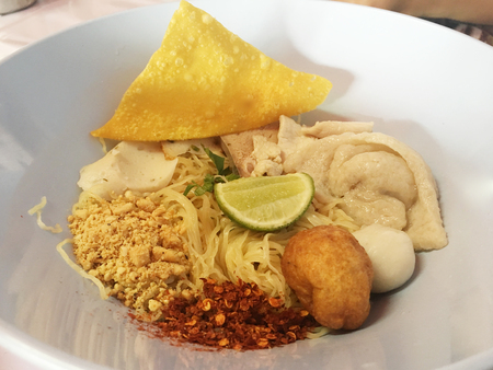 Close uo Thai spicy noodle with fish balls. Thai Foodの写真素材