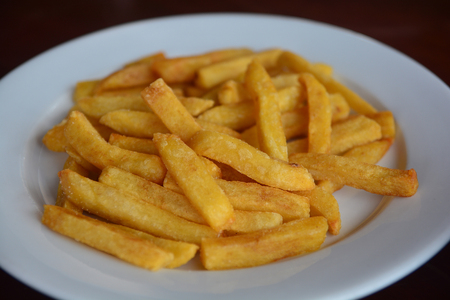 Close up French fries on white plate. foodの写真素材