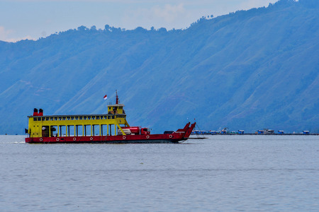 Tourist Boat Running on beautiful Lake Toba. This view from Samosir Island, North Sumatra, Indonesiaのeditorial素材