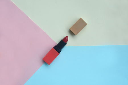 Red lipstick isolated on pastel background, Minimal makeup fashion concept. の写真素材