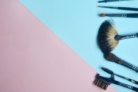 Creative flat lay of set of brush on pastel background, Minimal cosmetic beauty product concept with copy spaceの写真素材
