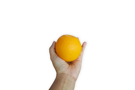 Hand holding orange on isolated on white backgroundの写真素材