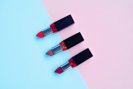 Set of red lipstick isolated on pastel background, Minimal makeup fashion concept.の写真素材