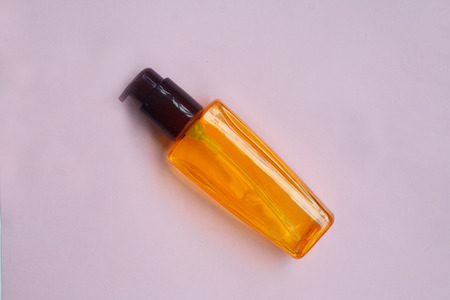 Skincare Flat lay yellow oil Hair serum  isolated on pastel background, Minimal makeup fashion concept.の写真素材