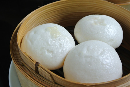 Salapao in bamboo steamer, Steamed stuff bun or Chinese Steamed Buns.の写真素材