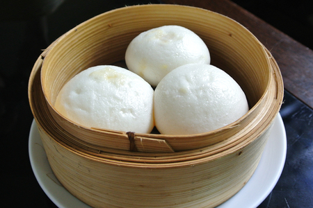 Salapao in bamboo steamer, Steamed stuff bun or Chinese Steamed Buns.の写真素材