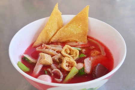 Yentafo noodle with Pink seafood noodles soup. fish meatball tofu and dumpling the good tasty food in the noodle resturant in Thailand, Thai Street Food.の写真素材