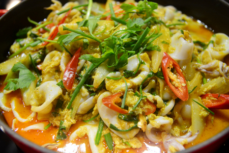 Stir Fried Squid with Curry a delicious and healthy way to eat squid. Thai famous food.の写真素材