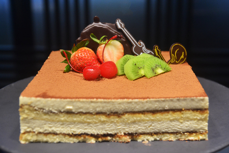 Cheesecake with Strawberry and kiwi fruit on a luxury all you can eat buffet in a hotel, assorted sweet flour dessert, cakes, in a cafe, bar, hotel restaurant or hotel.の写真素材
