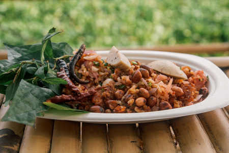 Yam naem khao thot , Thai cuisine originally from the Isan region. crispy-fried curried rice balls, fermented pork sausage,lime juice is eaten with raw leafy greens and fresh herbs. This dish is also known as naem khlukの写真素材