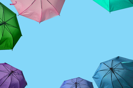 Vibrant colorful opened umbrellas background. Colorful umbrellas in the sky for wallpaper, summerの写真素材