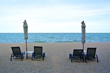 Beach chair and umbrella on idyllic tropical sand beach. Phuket, Thailandの写真素材