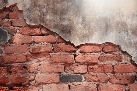Empty Old Brick Wall Texture. Painted Distressed Wall Surface. Grungy Wide Brickwall. Grunge Red Stonewall Background. Shabby Building Facade With Damaged Plaster. Abstract Web Banner. Copy Space.の写真素材
