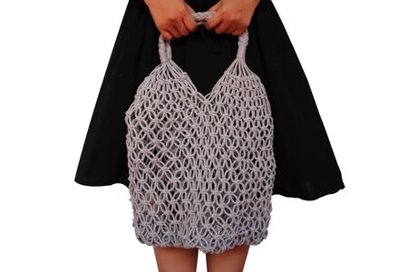 Young woman holding Reusable string shopping eco mesh bag Isolated on wgite background. Concept no plastic, zero waste and eco frendly.の写真素材