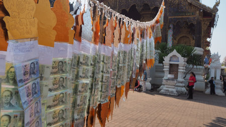 a group of binded banknote performing of Lanna belief's,Chaingmai,Thailand.のeditorial素材