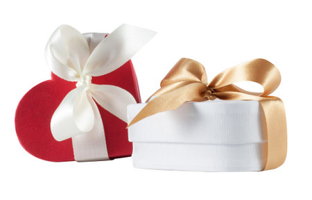 white and red heart shaped gift box over white background