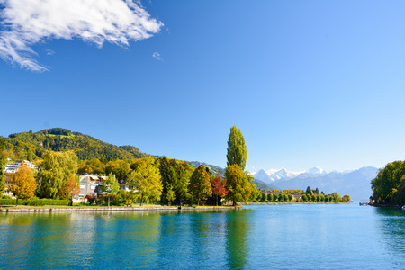 Lake Thun with Jungfrau mountain in autumn on clear blue sky , Switzerland, Shot using CPL  filterの写真素材