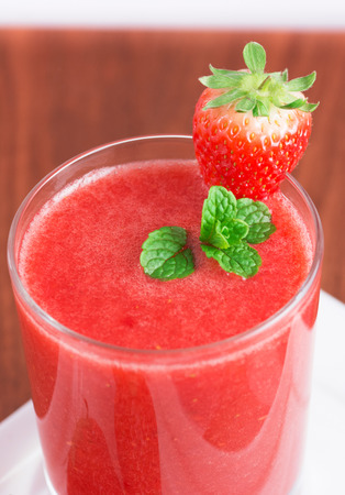 A glass of Fresh strawberry smoothieの写真素材