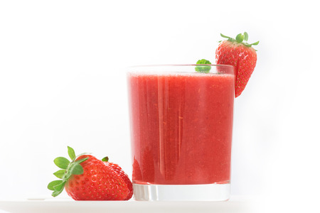 A glass of Fresh strawberry smoothieの写真素材