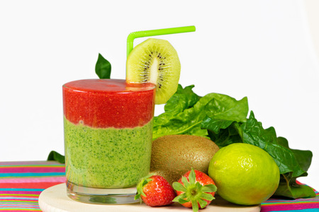 Healthy green and red smoothie with  strawberry,kiwi,apples,spinach,cucumber,limeの写真素材