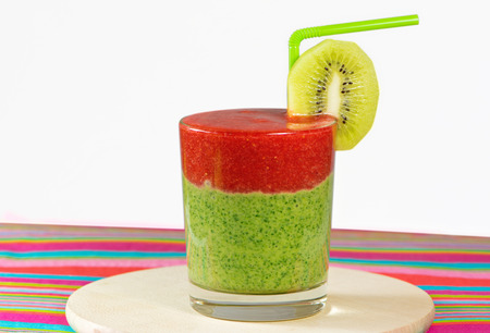 Healthy green and red smoothie with  strawberry,kiwi,apples,spinach,cucumber,limeの写真素材