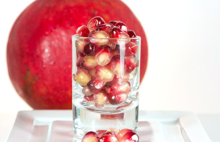 fresh healthy tropical pomegranate seed in glassの写真素材