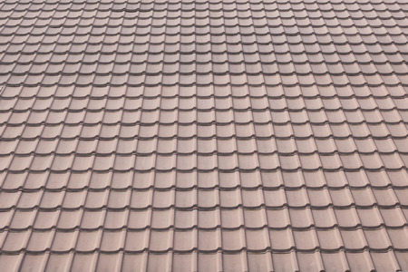 ceramic tile roof on a background of house.の写真素材