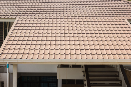 ceramic tile roof on a background of house.の写真素材