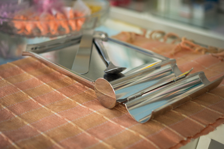 Stainless pill counting tray on fabric backgroundの写真素材