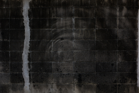 Old brick wall background. Grunge texture. Black wallpaper. Dark surfaceの写真素材