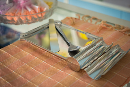 Stainless pill counting tray on fabric backgroundの写真素材