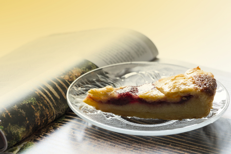 Leisure reading book with pie in morning timeの写真素材
