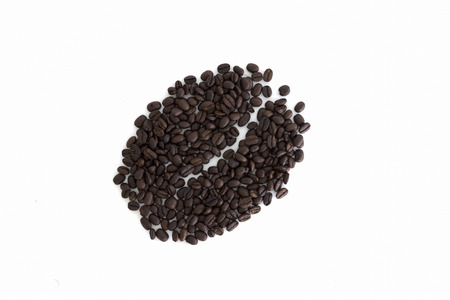 Big coffee bean shape made of coffee beans, white backgroundの写真素材