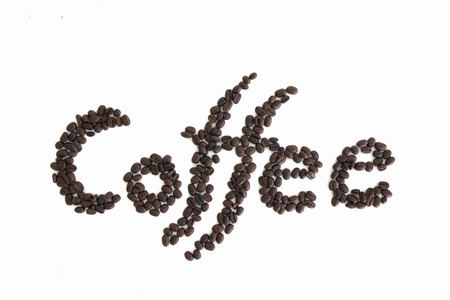 The word Coffee spelled with hundreds of coffee beans. Isolated against white backgroundの写真素材
