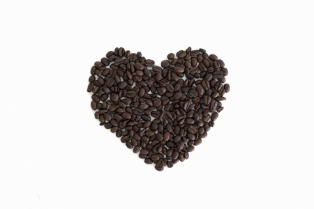 heart from coffee beans isolated on a white backgroundの写真素材