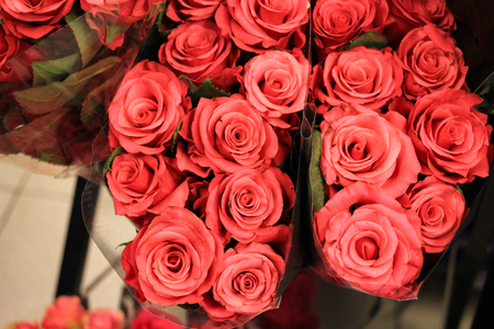 Heap of red roses in a retail market for sellの写真素材