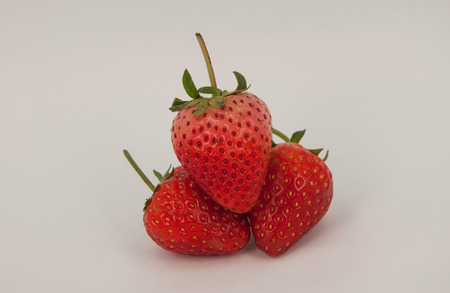 three strawberries isolated on white backgroundの写真素材