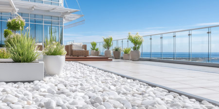 Modern rooftop terrace, ocean view, white stone garden, luxury outdoorの素材