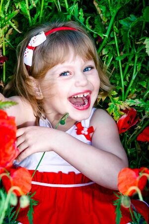 girl in the field lies and laughsの写真素材
