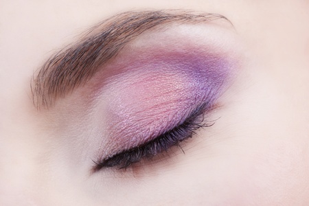 Woman beautiful eye with bright pink and violet makeup の写真素材