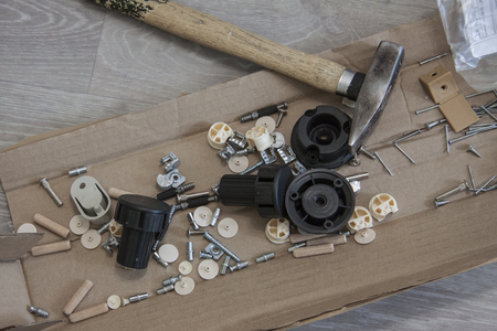 Furniture assembly. Works indoors. Metal and plastic fittings for mountingの写真素材