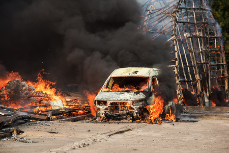 Huge fire of buildings and carsの写真素材