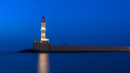 Chania, Crete, Greece: lighthouse in Venetian harbor in the sunset