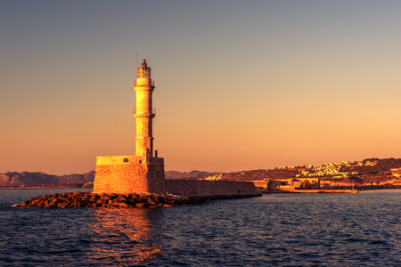 Chania, Crete, Greece: lighthouse in Venetian harbor in the sunset