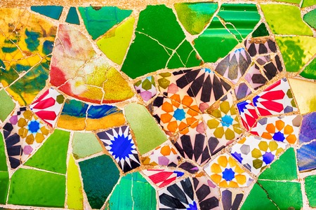 Barcelona, Catalonia, Spain: mosaic in the Park Guell of Antoni Gaudi at sunsetの写真素材