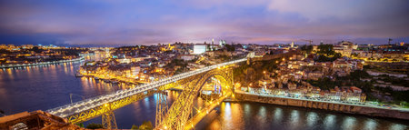 Porto, Portugal: the Dom Luis I Bridge and the old town at sunsetの写真素材